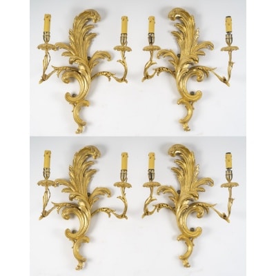Suite de 4 appliques de style rocaille en bois sculpté et doré, circa 1900