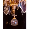 Victor Raulin (1867-1925) et Baccarat Lustre aux Amours en bronze ciselé et doré de style Louis XV | Biron 