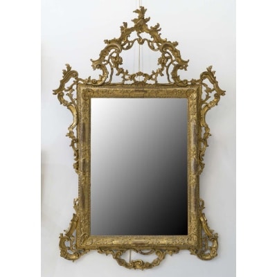 Miroir italien en bois sculpté doré d'époque XIXème siècle