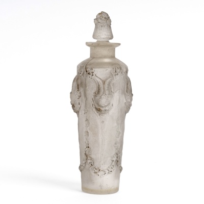 flacon "Pan" verre blanc patiné gris de René LALIQUE